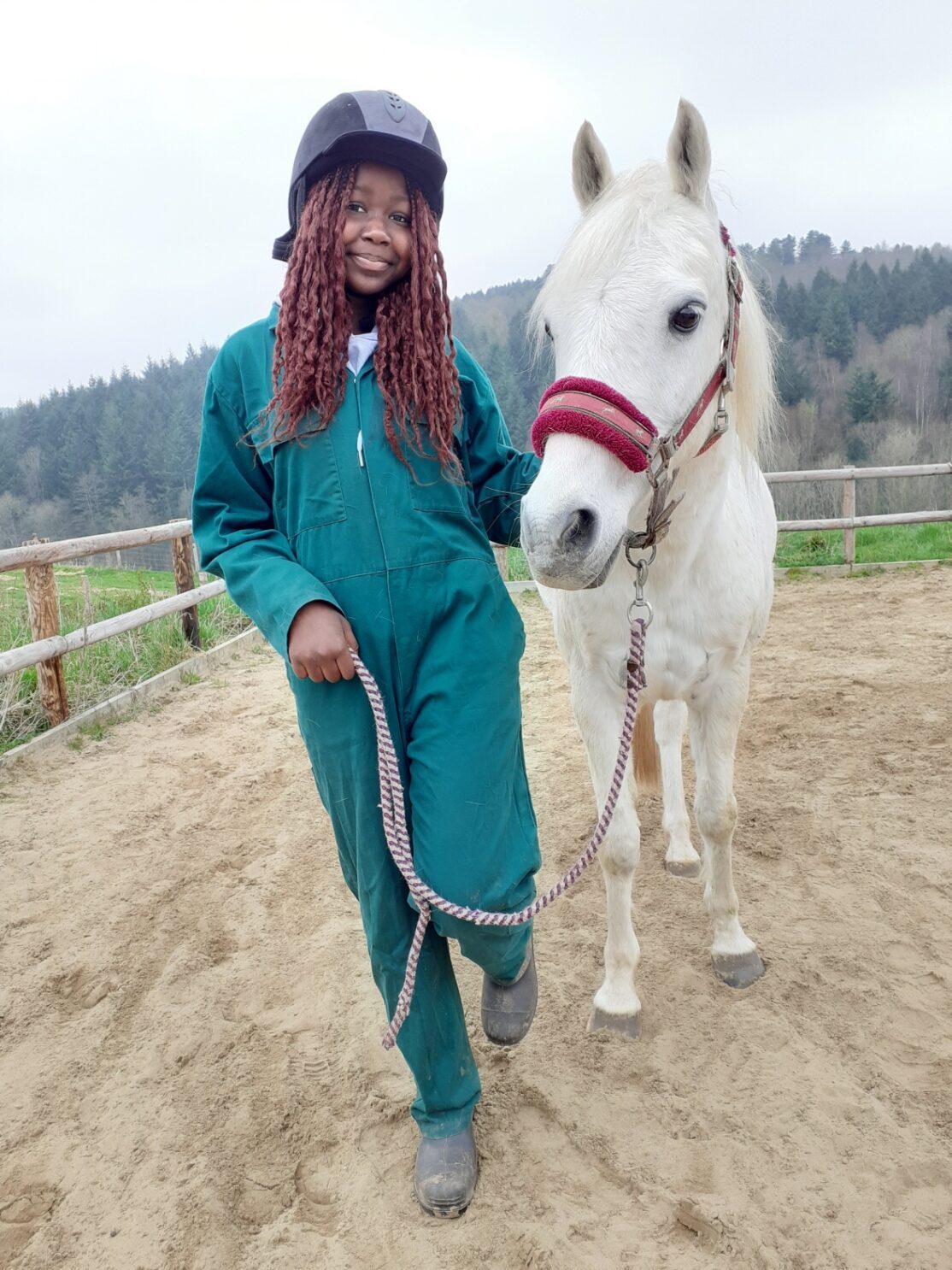 girl smiling with horse