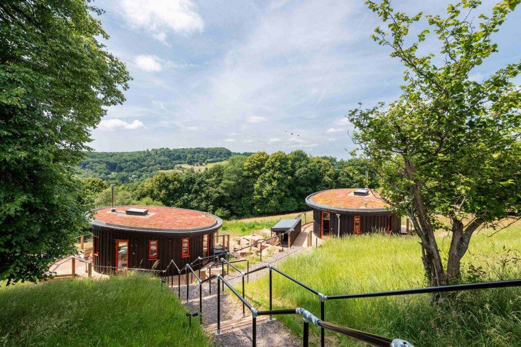 Two cabins sat on hillside overlooking Wye Valley