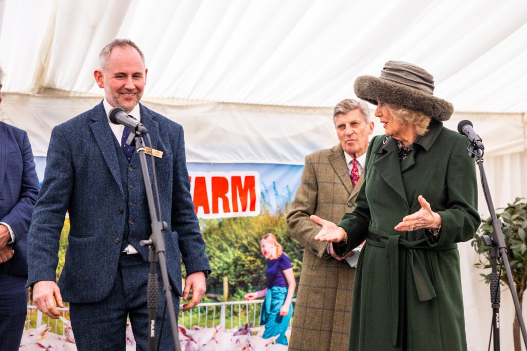 Her Majesty and Jamie's Feilden speaking to guests