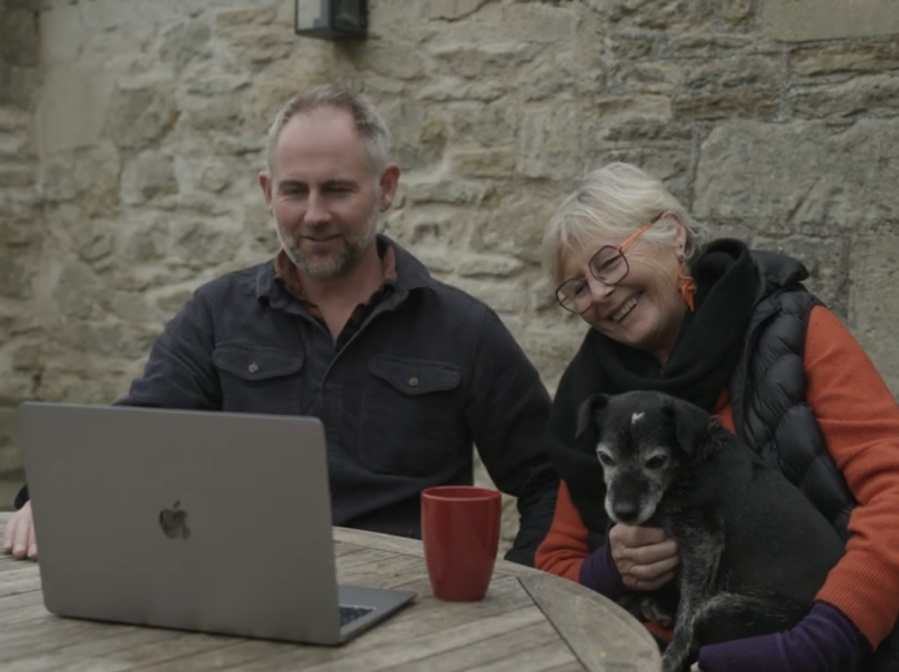 Founders, Jamie and Tish, sat watching a film of the first visit to the farm