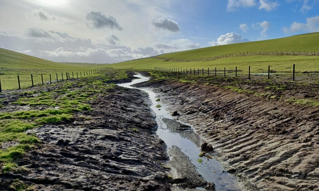 An image showing the process of de-culverting and introducing bends to the streams at the farm.